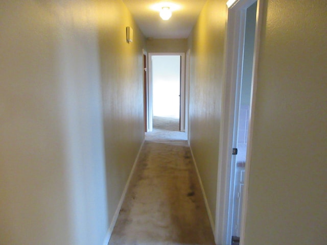 611 W 4th St, Homer, LA 71040 - corridor with baseboards and light colored carpet