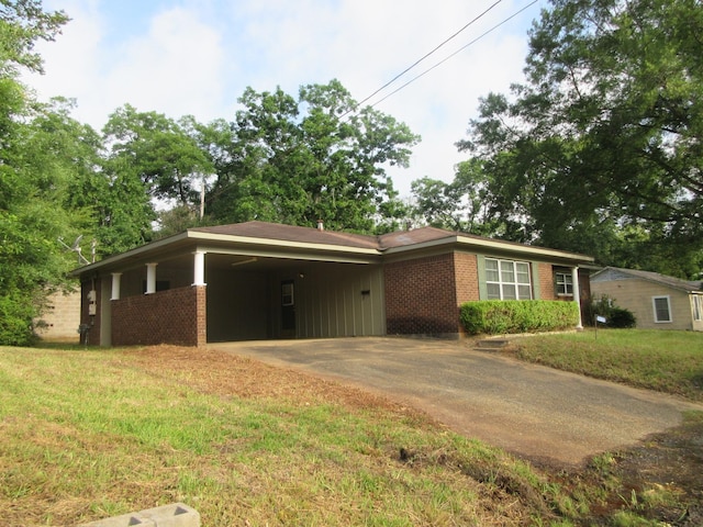 611 W 4th St, Homer, LA 71040 - ranch-style home with concrete driveway, a carport, brick siding, and a front yard