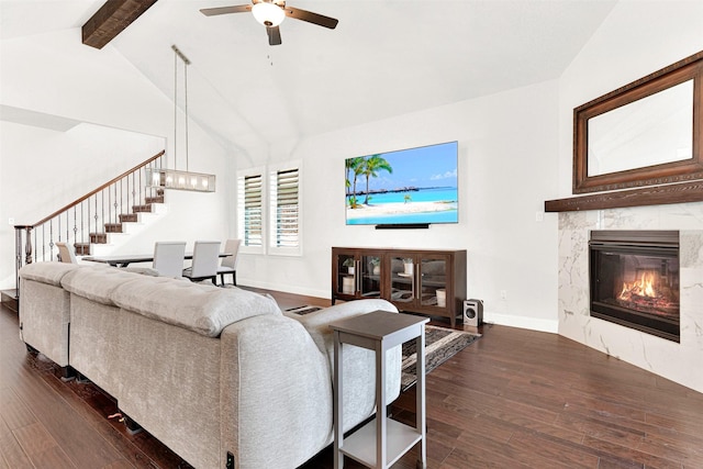 3912 River Bend St, Mckinney, TX 75071 - living area featuring dark wood-style flooring, a ceiling fan, beam ceiling, stairs, and baseboards