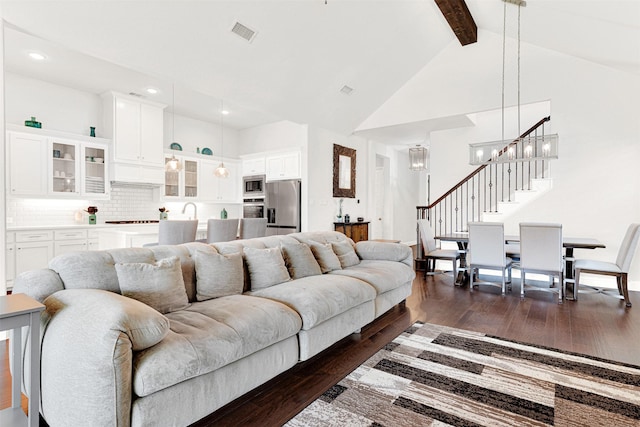 3912 River Bend St, Mckinney, TX 75071 - living area with high vaulted ceiling, dark wood-style flooring, beam ceiling, stairs, and recessed lighting