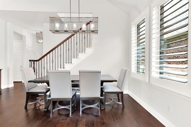 3912 River Bend St, Mckinney, TX 75071 - dining room with a chandelier, plenty of natural light, stairway, vaulted ceiling, and wood finished floors