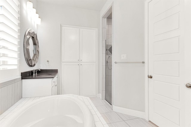 3912 River Bend St, Mckinney, TX 75071 - bathroom featuring a garden tub, vanity, a tile shower, and tile patterned floors