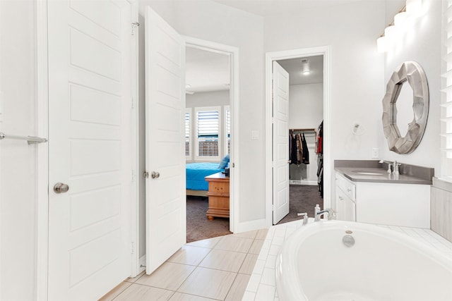 3912 River Bend St, Mckinney, TX 75071 - ensuite bathroom with vanity, a bath, and baseboards