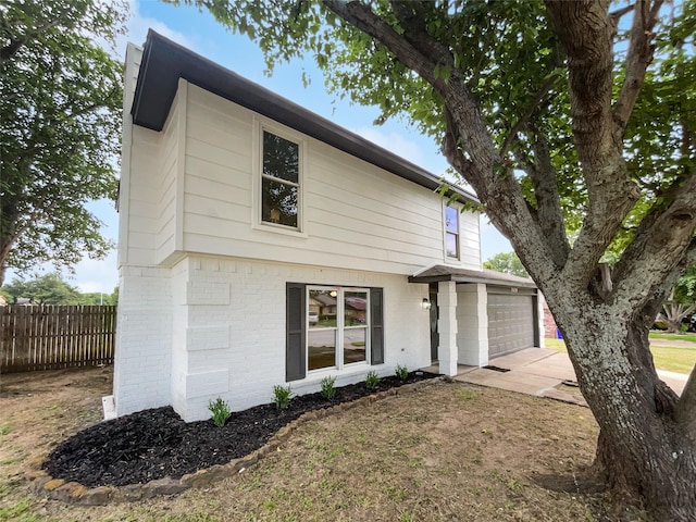 7620 Clover Ln, Watauga, TX 76148 - view of front of house featuring driveway and brick siding