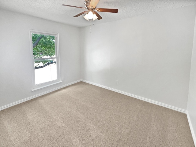 7620 Clover Ln, Watauga, TX 76148 - spare room featuring a textured ceiling, carpet floors, a ceiling fan, and baseboards