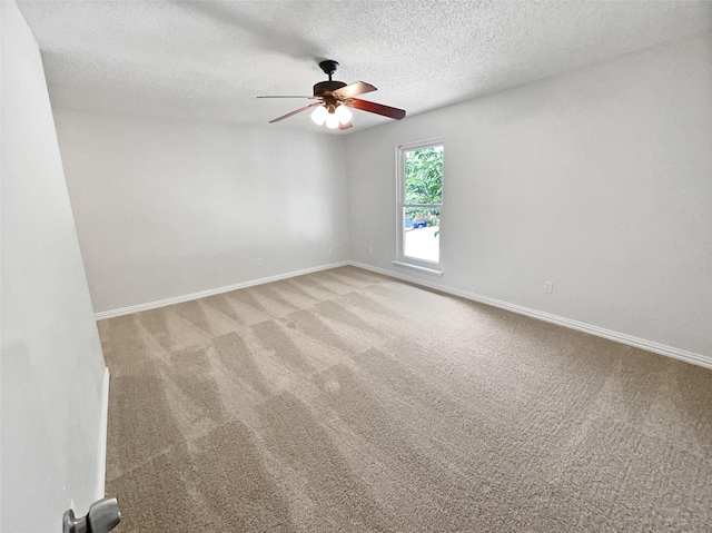 7620 Clover Ln, Watauga, TX 76148 - spare room with a ceiling fan, light colored carpet, a textured ceiling, and baseboards