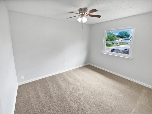 7620 Clover Ln, Watauga, TX 76148 - carpeted spare room featuring a ceiling fan, baseboards, and a textured ceiling