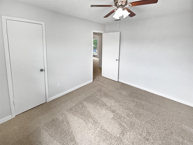 7620 Clover Ln, Watauga, TX 76148 - unfurnished bedroom with carpet floors, baseboards, and ceiling fan