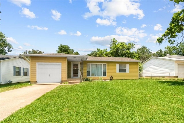 2311 Anderson St, Irving, TX 75062 - single story home with an attached garage, concrete driveway, and a front lawn