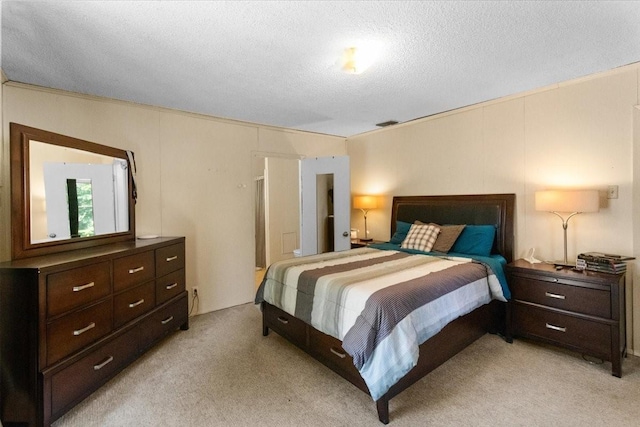 2311 Anderson St, Irving, TX 75062 - bedroom featuring light colored carpet and a textured ceiling