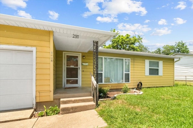 2311 Anderson St, Irving, TX 75062 - property entrance featuring a yard and an attached garage