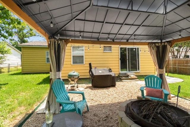 2311 Anderson St, Irving, TX 75062 - rear view of property with a gazebo, a fire pit, and entry steps