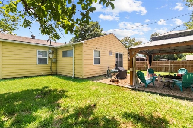 2311 Anderson St, Irving, TX 75062 - back of property featuring a gazebo, an outdoor fire pit, and a patio