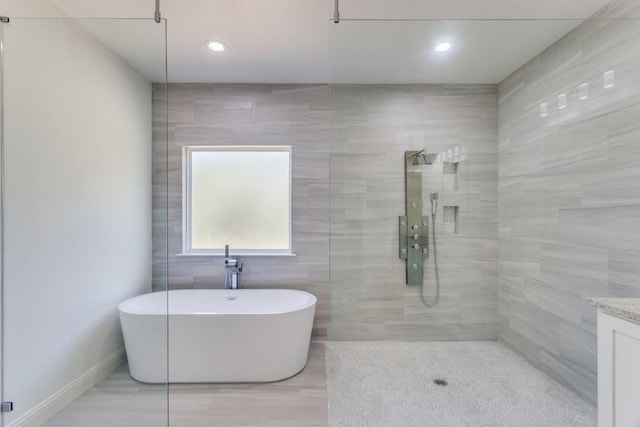 103 Jim Walters Dr, Runaway Bay, TX 76426 - bathroom featuring a freestanding bath, a walk in shower, vanity, and recessed lighting