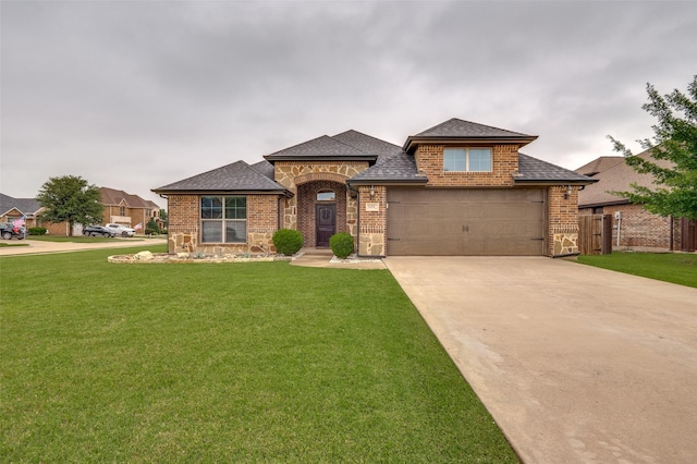 101 Aucuba Ln, Waxahachie, TX 75165 - view of front of house with brick siding, a shingled roof, driveway, and a garage