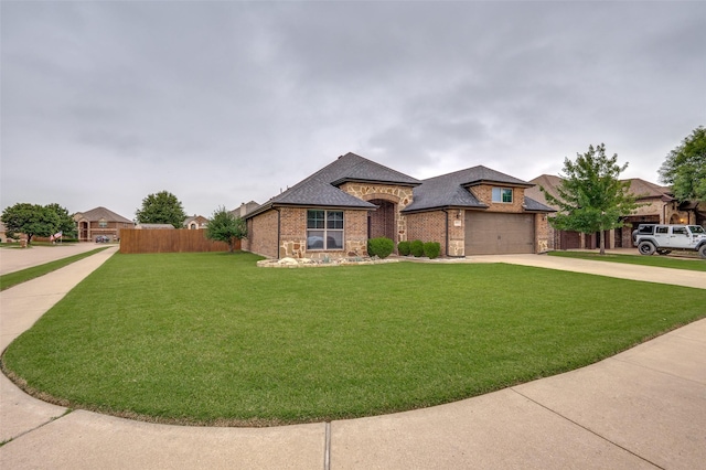 101 Aucuba Ln, Waxahachie, TX 75165 - french provincial home with brick siding, concrete driveway, and roof with shingles