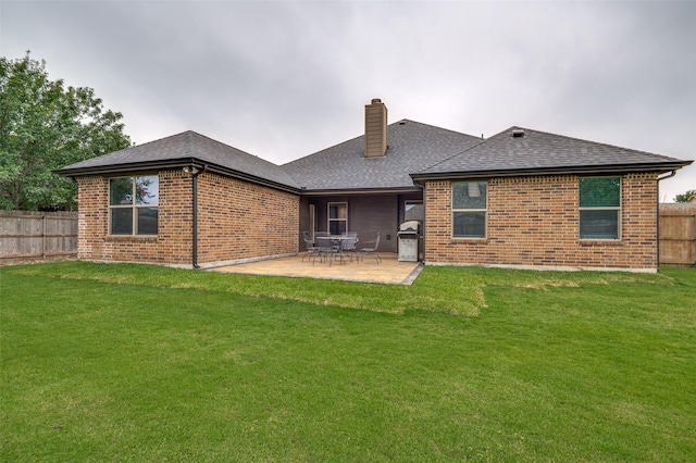 101 Aucuba Ln, Waxahachie, TX 75165 - rear view of property with brick siding, a chimney, and a patio