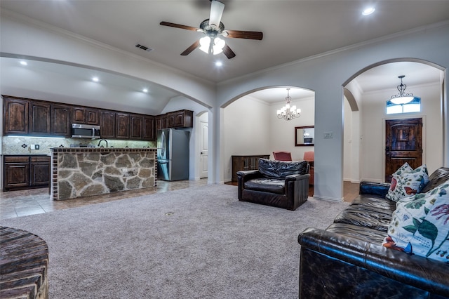 101 Aucuba Ln, Waxahachie, TX 75165 - living area with arched walkways, a ceiling fan, recessed lighting, crown molding, and lofted ceiling