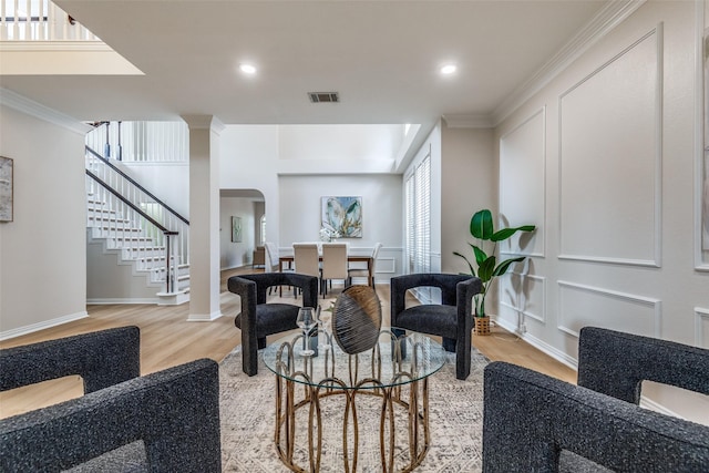 4037 Azure Ln, Addison, TX 75001 - living room with light wood-style floors, stairs, arched walkways, ornamental molding, and recessed lighting