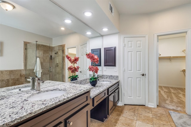 4037 Azure Ln, Addison, TX 75001 - full bath with a shower stall, double vanity, a walk in closet, recessed lighting, and baseboards