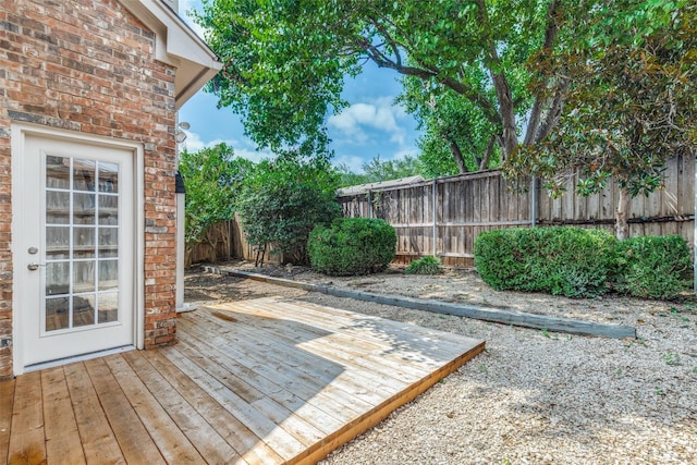 4037 Azure Ln, Addison, TX 75001 - wooden terrace with a fenced backyard