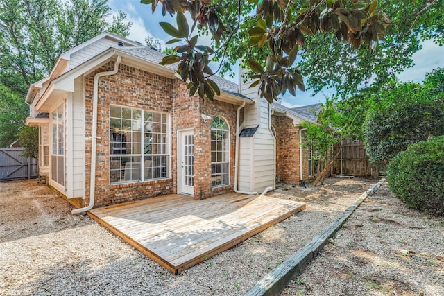 4037 Azure Ln, Addison, TX 75001 - rear view of property featuring brick siding, a deck, roof with shingles, and a gate