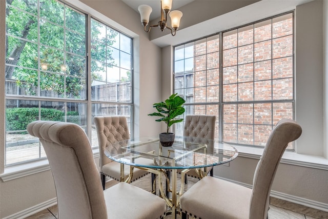 4037 Azure Ln, Addison, TX 75001 - dining room featuring baseboards and a chandelier
