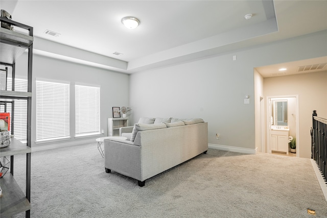 1507 Calcot Ln, Forney, TX 75126 - living area with carpet floors, a tray ceiling, and baseboards