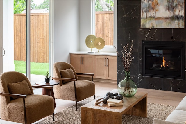 10321 Lakemere Dr, Dallas, TX 75238 - living area with light wood-style floors, plenty of natural light, and a fireplace