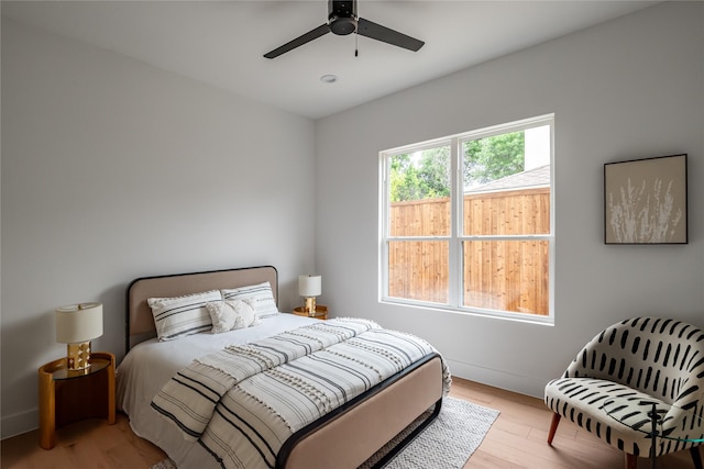 10321 Lakemere Dr, Dallas, TX 75238 - bedroom featuring wood finished floors, baseboards, and ceiling fan