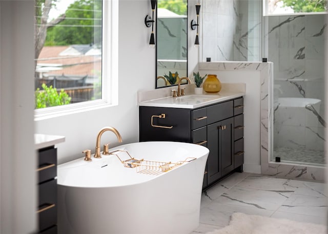 10321 Lakemere Dr, Dallas, TX 75238 - full bathroom featuring vanity, marble finish flooring, a marble finish shower, and a freestanding tub