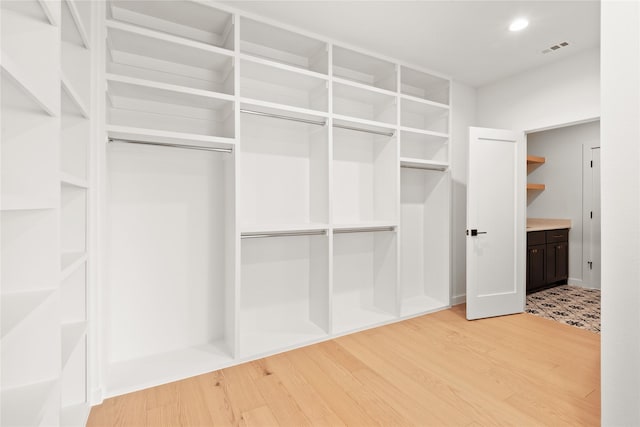 10321 Lakemere Dr, Dallas, TX 75238 - spacious closet with light wood-type flooring