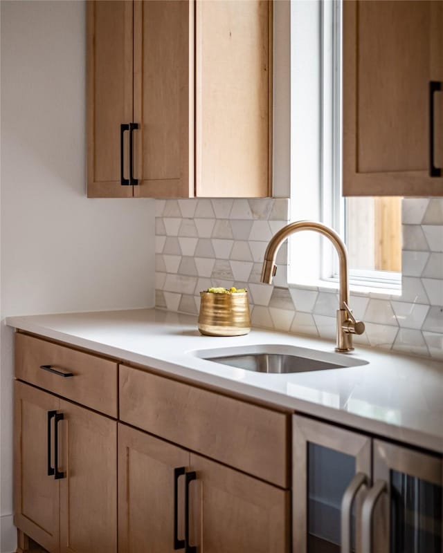 10321 Lakemere Dr, Dallas, TX 75238 - kitchen with beverage cooler, a sink, tasteful backsplash, and light countertops