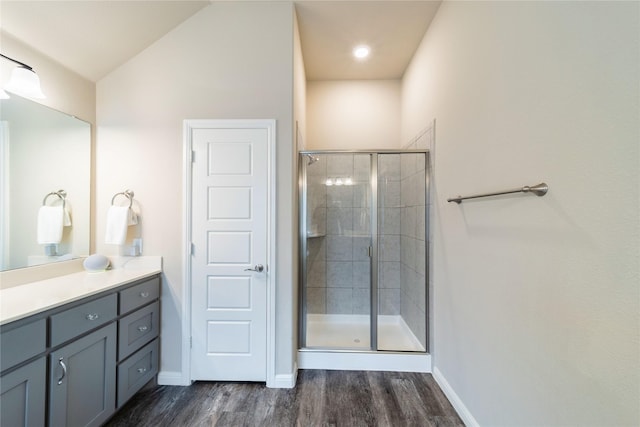 293 Cisco Trl, Forney, TX 75126 - full bathroom featuring a stall shower, wood finished floors, vanity, and baseboards