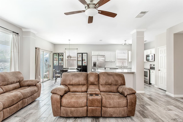 1253 Stone Ln, Celina, TX 75009 - living room with a ceiling fan, light wood-style floors, and baseboards