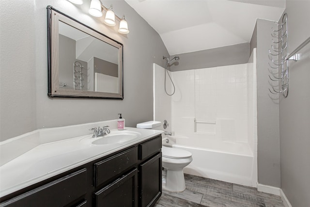 1253 Stone Ln, Celina, TX 75009 - bathroom featuring vanity, toilet, tub / shower combination, lofted ceiling, and wood finished floors