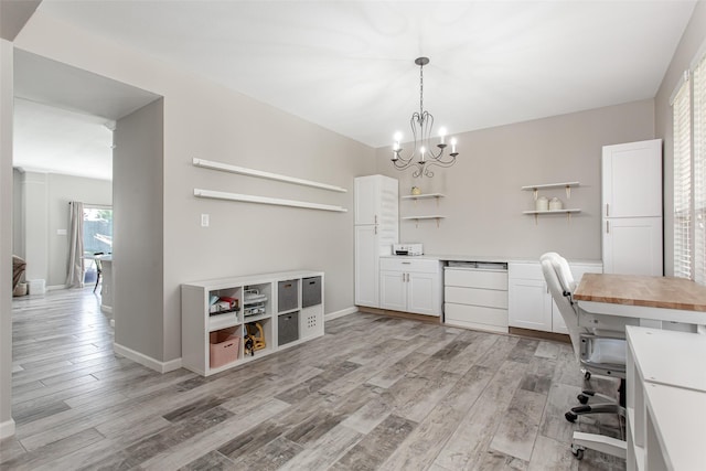 1253 Stone Ln, Celina, TX 75009 - office area with light wood-style floors, a chandelier, and baseboards