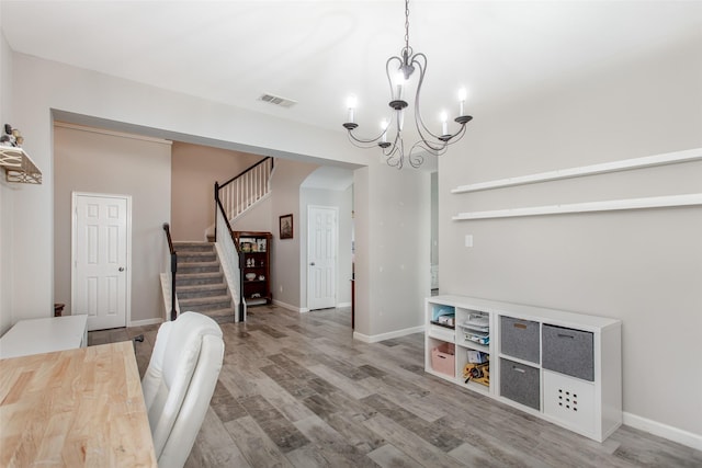 1253 Stone Ln, Celina, TX 75009 - office space featuring a chandelier, wood finished floors, arched walkways, and baseboards
