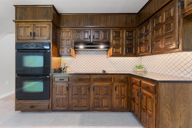 7624 Lake Highlands Dr, Fort Worth, TX 76179 - kitchen featuring black appliances, under cabinet range hood, decorative backsplash, and dark countertops
