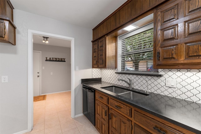 7624 Lake Highlands Dr, Fort Worth, TX 76179 - kitchen with black dishwasher, a sink, dark countertops, and backsplash