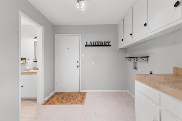 7624 Lake Highlands Dr, Fort Worth, TX 76179 - laundry area featuring cabinet space, washer hookup, and baseboards
