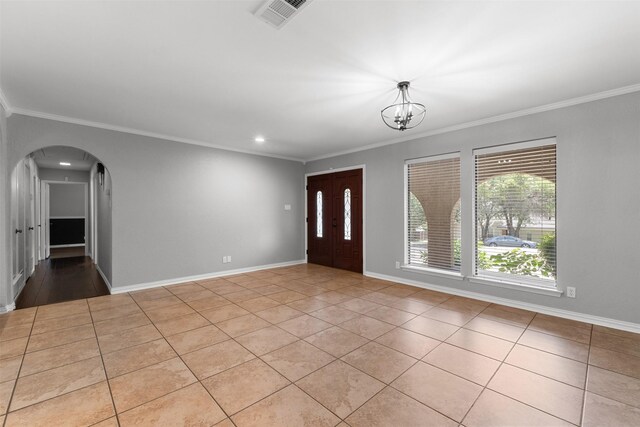 7624 Lake Highlands Dr, Fort Worth, TX 76179 - foyer entrance featuring crown molding, arched walkways, tile patterned flooring, a chandelier, and recessed lighting