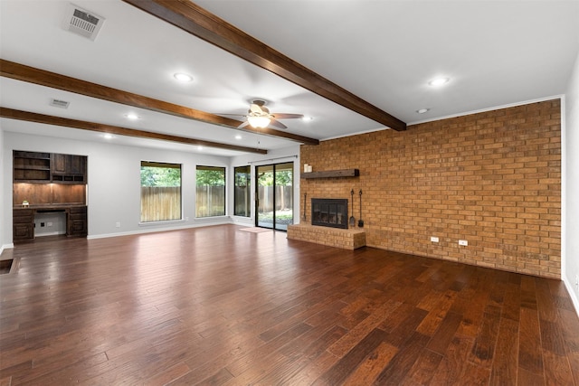 7624 Lake Highlands Dr, Fort Worth, TX 76179 - unfurnished living room featuring a ceiling fan, a fireplace, brick wall, dark wood-style flooring, and beamed ceiling