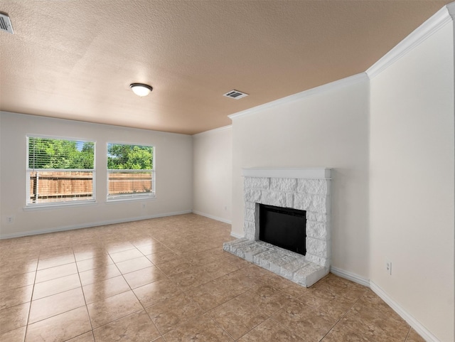 9849 Vickie Ln, Frisco, TX 75035 - unfurnished living room featuring tile patterned flooring, a stone fireplace, crown molding, a textured ceiling, and baseboards