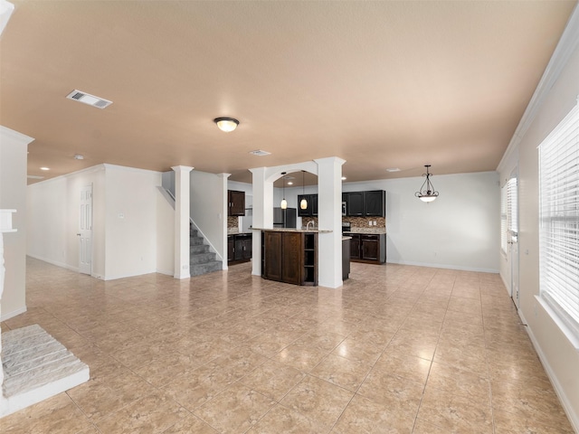 9849 Vickie Ln, Frisco, TX 75035 - unfurnished living room featuring light tile patterned floors, baseboards, ornamental molding, and stairway