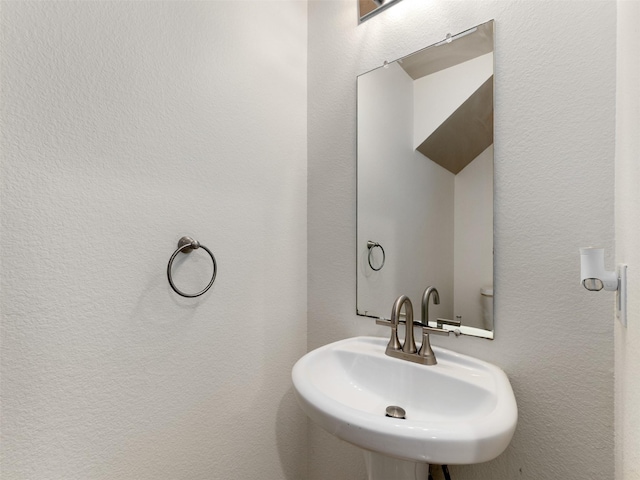 9849 Vickie Ln, Frisco, TX 75035 - bathroom with a sink and a textured wall