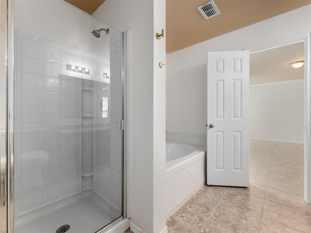 9849 Vickie Ln, Frisco, TX 75035 - full bath featuring a shower stall, a bath, and tile patterned floors