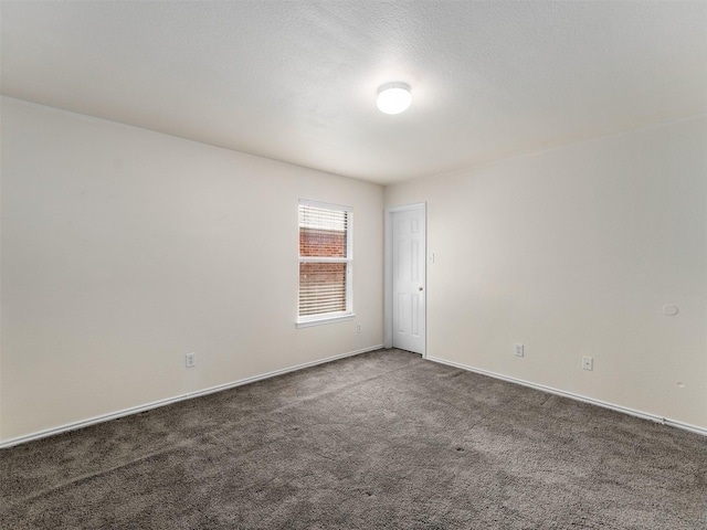 9849 Vickie Ln, Frisco, TX 75035 - spare room featuring carpet floors and baseboards