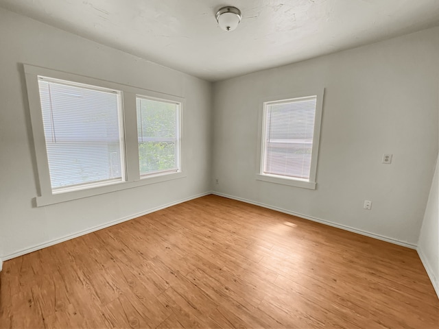 109 S 5th St, Sanger, TX 76266 - empty room with light wood-style flooring and baseboards
