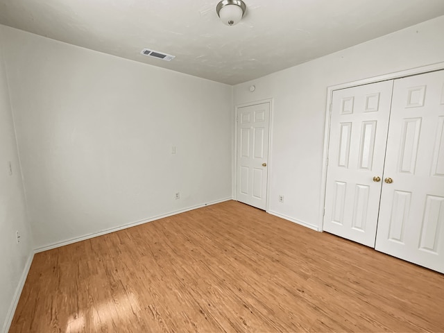 109 S 5th St, Sanger, TX 76266 - unfurnished bedroom with light wood finished floors, baseboards, and a closet